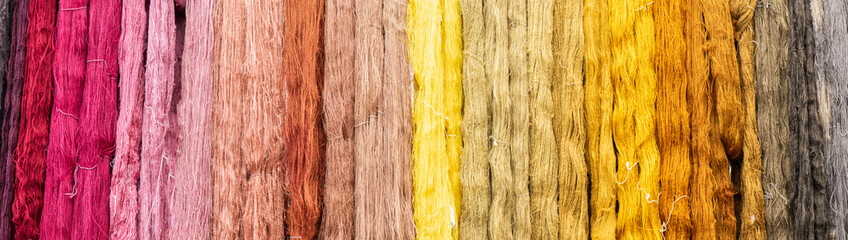 Paranoma with texture of yarn from cotton and multicolored natural dyed thread.