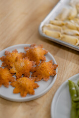 Unique, colorful, star-shaped pasta handmade and displayed alongside other unique colors and shapes of pasta. The gourmet dish is all-natural and prepared with organic ingredients.
