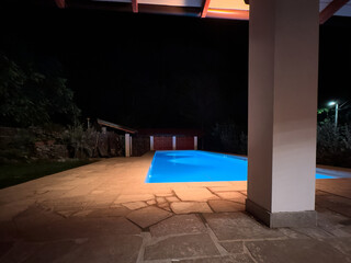 Fantastic blue pool, at night, nestled in the forest.
