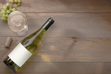 Bottle of white wine with a label, grapes and a cork. Wine bottle mockup.