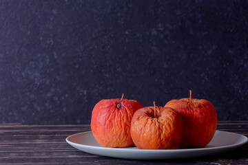 Rotten apple as a concept of corruption. Concept of bad people in society. Rotten politicians.