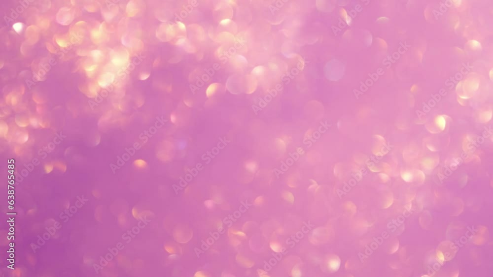 Wall mural abstract movement of gold bokeh lights on purple background. blurry gold particles float and glisten
