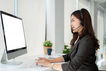 A beautiful Asian female customer support agent is helping a customer fix their problems online.