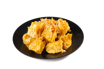 chinese style food dumplings placed in a black plate