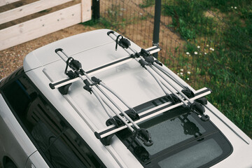 Outdoor Adventure Awaits. Family Car with Bicycles Mounted on Roof Rack. A vehicle with top mounted bikes.