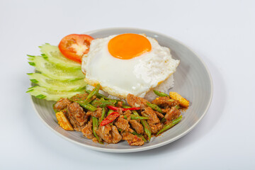 Beef Panang Curry. Thai food. Coconut milk curry and fried egg with rice on white background.