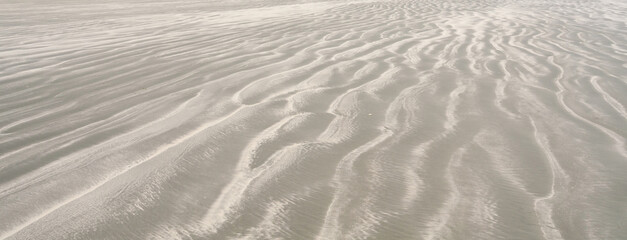 Sand patterns on the beach at Okains Bay, South Island, New Zealand