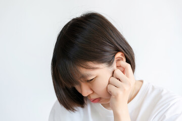 Thai women with short hair touch their ears because itchy or hurt their ears.