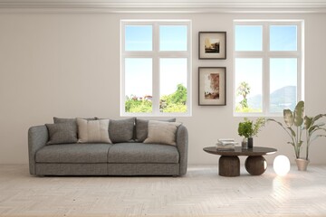 Fototapeta premium White living room with sofa and summer landscape in window. Scandinavian interior design. 3D illustration