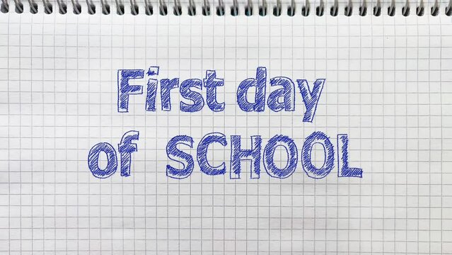 The text First day of School is drawn by hand on a page of a school notebook and animated.