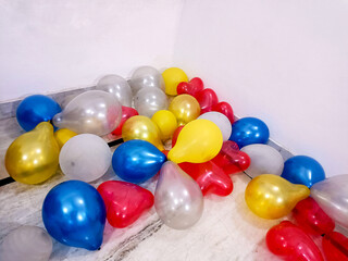 lot of coloured baloons on the floor