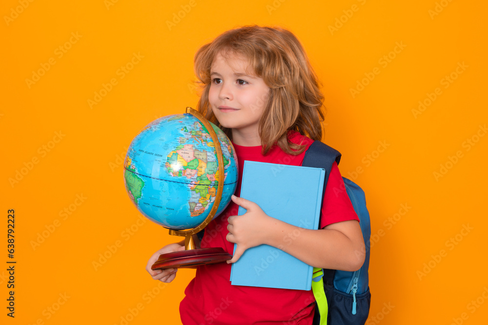 Poster back to school. school child with world globe and book. portrait of school boy isolated on yellow st