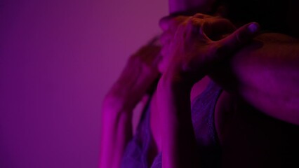 Male romantically touching female skin