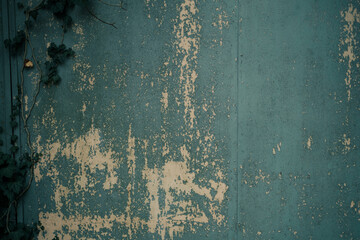Blue old wall with peeling paint, background.