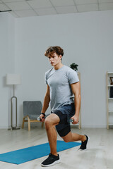 Obraz premium home man gray dumbbells lifestyle indoor hobby sport training health activity