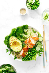 Salmon avocado bowl with broccoli, green peas, rice and fresh salad. Healthy food, top view - 638805019