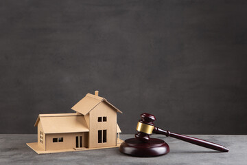 House model and gavel on the desk, Real property law concept, real estate auction
