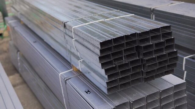 Metal profile C. Construction of a house. Construction of walls and partitions. Constructions for OSB, drywall, plywood. Production of metal profiles. Unloading and loading packs of building materials