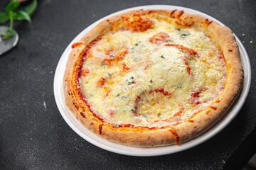pizza four cheeses mozzarella, gorgonzola, parmesan, emmental cheese portioned slice ready to eat appetizer meal food snack on the table copy space food background rustic top view