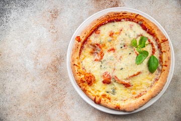 pizza four cheeses mozzarella, gorgonzola, parmesan, emmental cheese portioned slice ready to eat appetizer meal food snack on the table copy space food background rustic top view