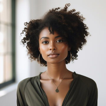 African-American woman with curly hair doing a photoshoot wearing casual clothes