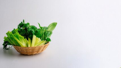 Fototapeta premium Fresh vegetable in a wooden basket on table.