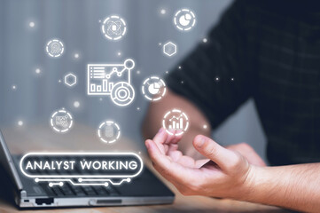 Businessman or Analyst working with Business Analytics and Data Management System on virtual screen,Corporate strategy for finance, operations, sales, marketing.