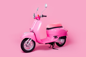 Obraz na płótnie Canvas Photo of bright transport for woman comfortable seat italian style scooter isolated on pink color background