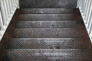 Old rusty black diamond metal plate background, grunge texture of dark metallic sheet with...
