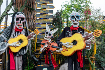 Dia de los Muertos (Day of the Dead) skeletons and sugar skulls, funny catrinas musicians playing...