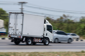 Truck running on the road, Small truck on the road, motion image of small truck running on the load.