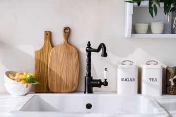 water tap in retro design over sink, detail of kitchen interior