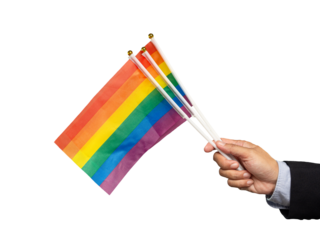 Close-up of a hand holding rainbow flags against a transparent background.
