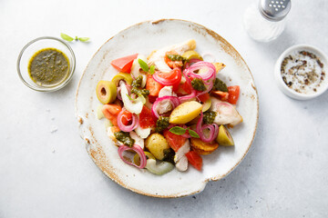 Healthy potato salad with tomatoes and olives