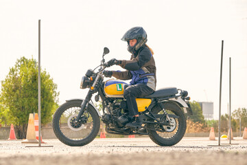 Fototapeta na wymiar Woman riding motorcycle on motordrome