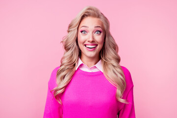 Photo of astonished impressed lovely lady wavy hairstyle dressed stylish pullover isolated on pink color background