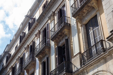 Fototapeta premium Historic facade with balconies of one of the tenement houses in Barcelona,