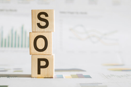 Alphabet letter block in word SOP (Abbreviation Standard Operating Procedure) on financial background