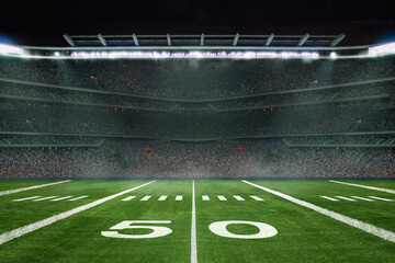 green field in american football stadium. ready for game in the midfield