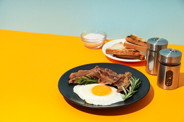 Tasty breakfast and delicious meat food concept - fried bacon