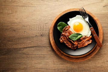 Tasty breakfast and delicious meat food concept - fried bacon