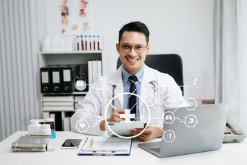 medical technology concept,smart Asian doctor hand working with modern laptop computer with his...