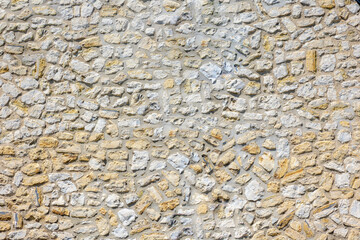 White yellow outdoor building wall, Gravel or stones material, Abstract soil surface background, Rock texture, Pebble ground pattern, Can be used as background for display or montage products.