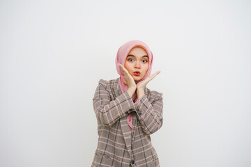 Image of excited young muslim businesswoman pink hijab standing isolated over white background....
