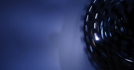 group of bicycle gears rotating, studio light