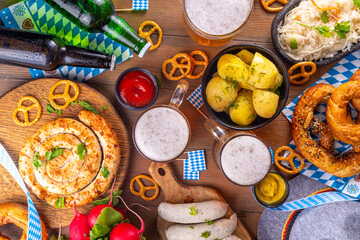  Oktoberfest munich traditional festival menu foods - bavarian sausages, pretzels, potato, sauerkraut, beer bottle and mug,  Background flyer for Oktoberfest invitation on old wooden table