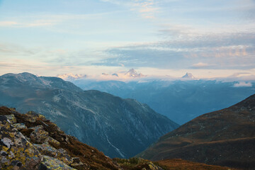 Fototapeta premium mountainous landscape with clouds in switzerland, swiss alps