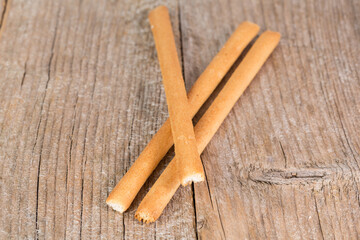 bread sticks grissini on wooden background