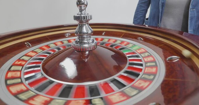 Croupier Spinning The Roulette Wheel. Spinning roulette in a casino. Spinning roulette in the casino close-up. Reletka close-up