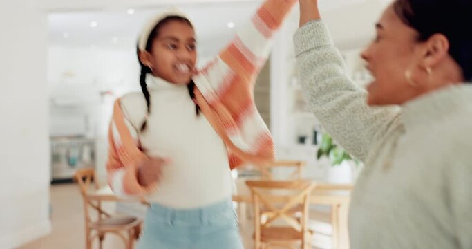 Mom, girl kid and dancing in home with energy, crazy song and happy freedom together. Excited mother, young child and jumping for fun party celebration, play and smile to enjoy music in living room